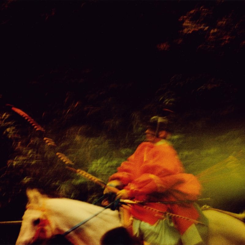 person on a white horse from the sunlanders series, color darkroom prints handmade by Sean Lotman