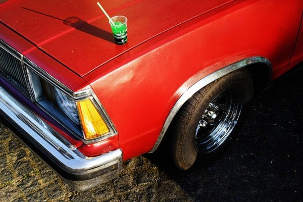 red car street photography, colorful, by Manuel Armenis