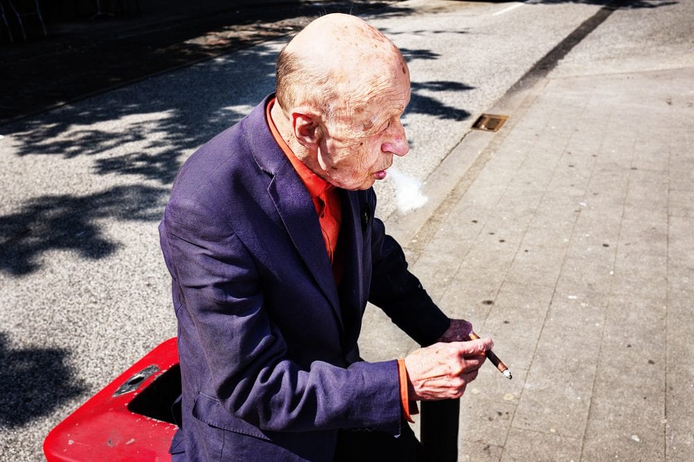 old man portrait street photography, colorful, by Manuel Armenis