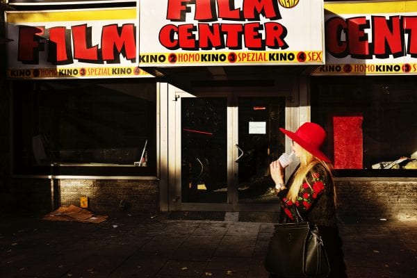 Diamond Days - woman in front of a shop street photography, colorful, by Manuel Armenis