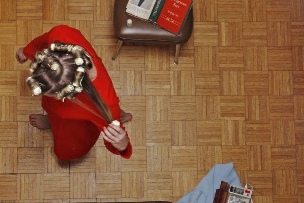 woman in living room color photography of patterns from above by Hayley Eichenbaum and Zach Swearingen