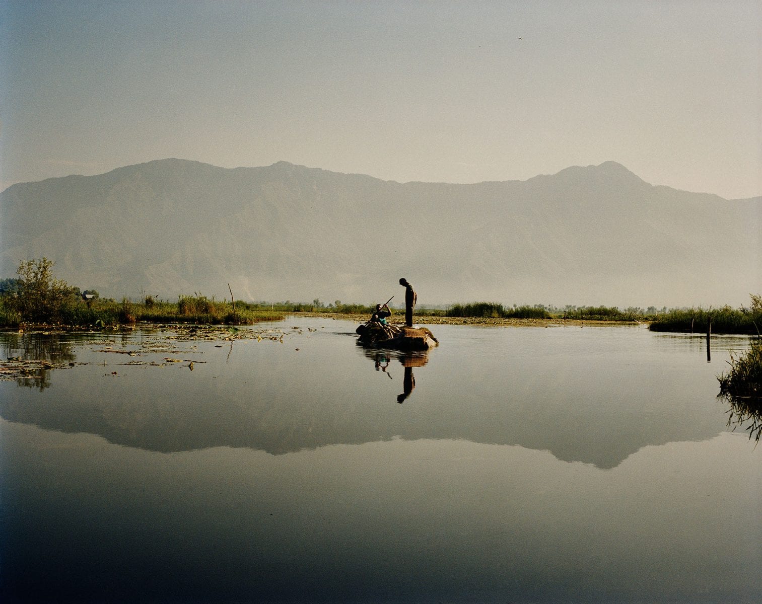 Travel photography portrait by Frédéric Lagrange. Man on a boat, Kashmir, India