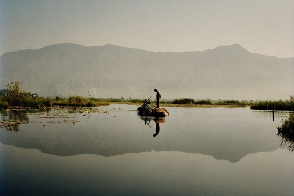 Travel photography portrait by Frédéric Lagrange. Man on a boat, Kashmir, India