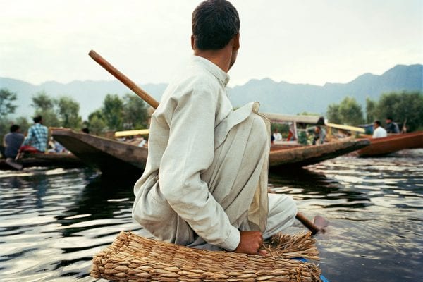 Travel photography portrait by Frédéric Lagrange. Man on a boat, Kashmir, India