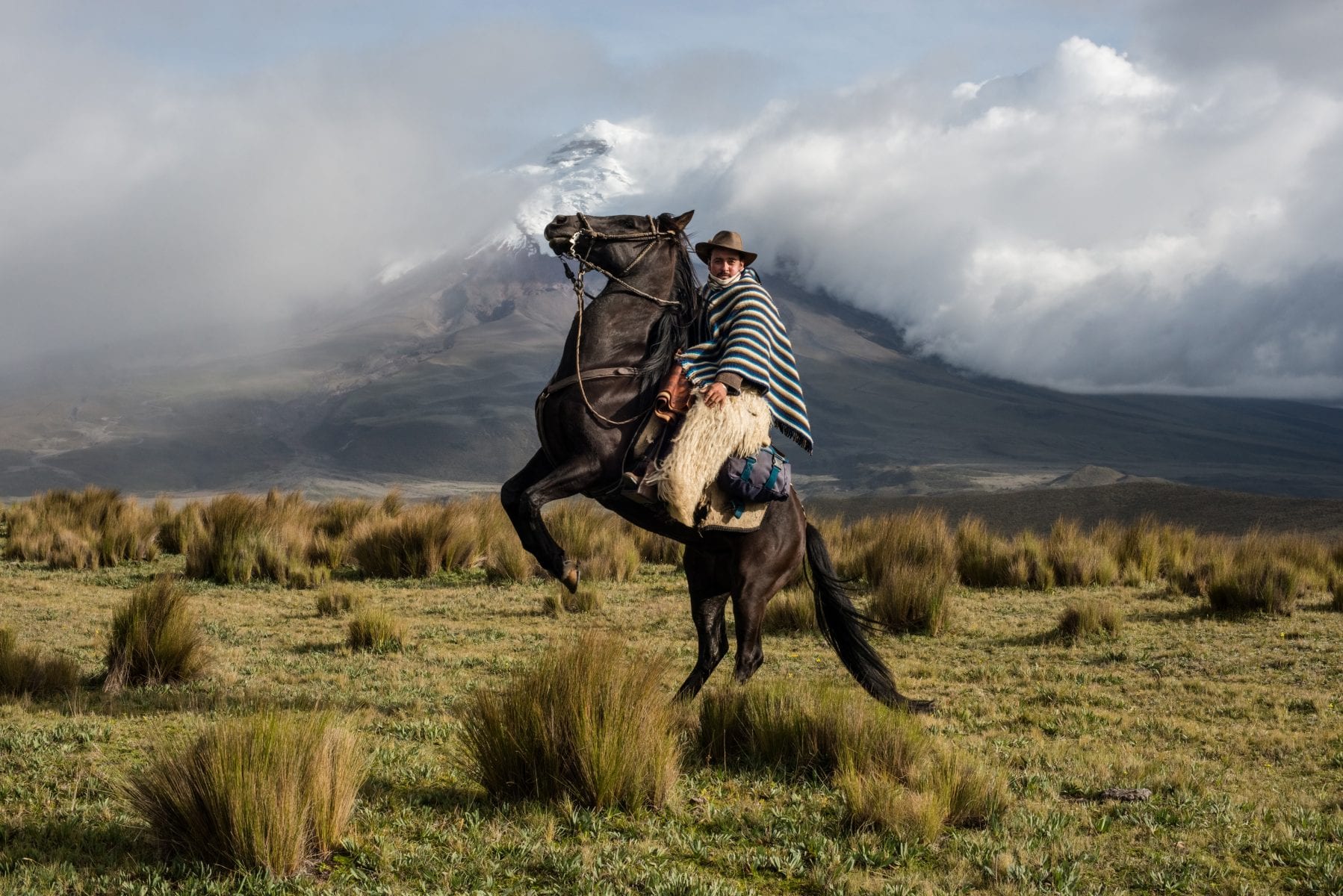 color portrait and landscape photo of a cowboy riding his horse by Luis Fabini. From the editorial, 10 inspiring photo series