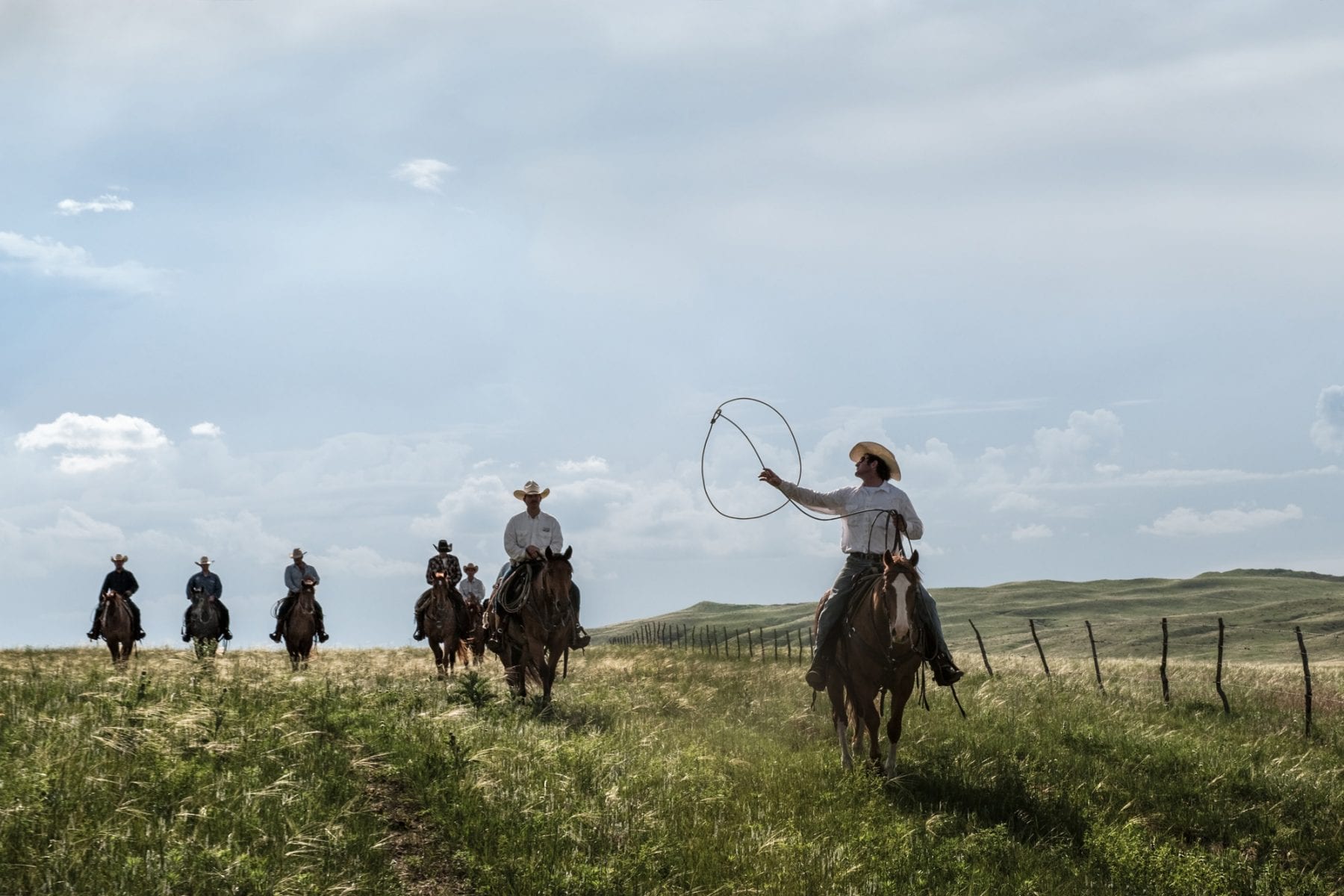 cowboys riding horses