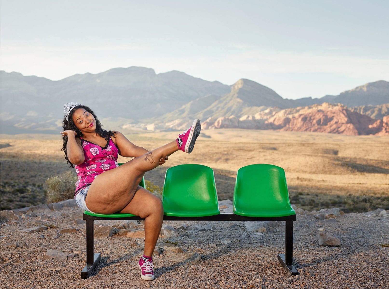 woman sitting on a green bench, color portrait photography by dylan collard