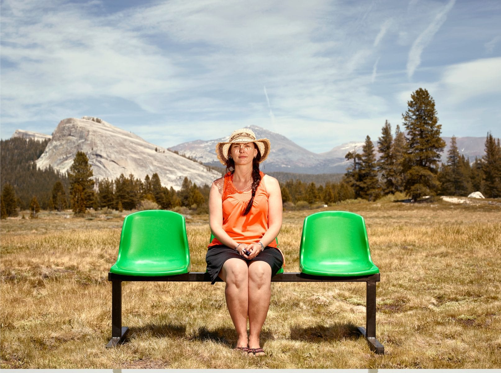 woman sitting on a green bench, color portrait photography by dylan collard