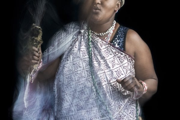 out of focus, blurry, colorful and very contrasted portrait of a healer from South Africa by Thom Pierce