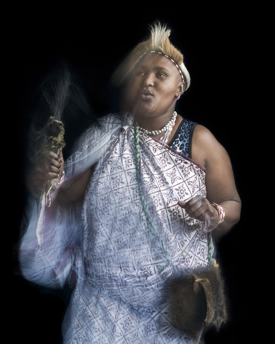 out of focus, blurry, colorful and very contrasted portrait of a healer from South Africa by Thom Pierce