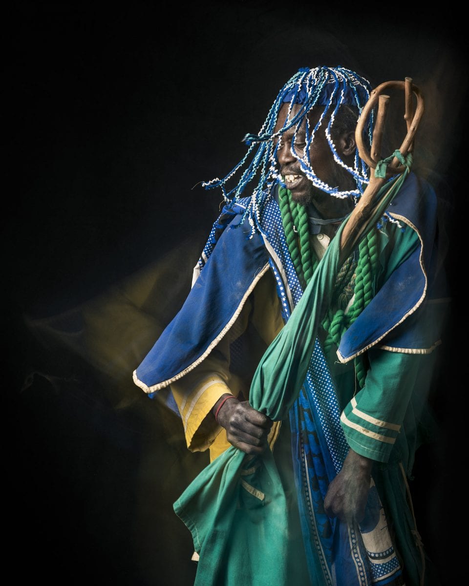 out of focus, blurry, colorful and very contrasted portrait of a healer from South Africa by Thom Pierce