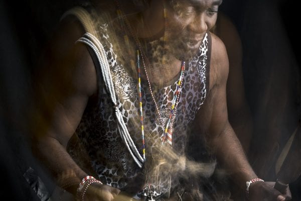 out of focus, blurry, colorful and very contrasted portrait of a healer from South Africa by Thom Pierce