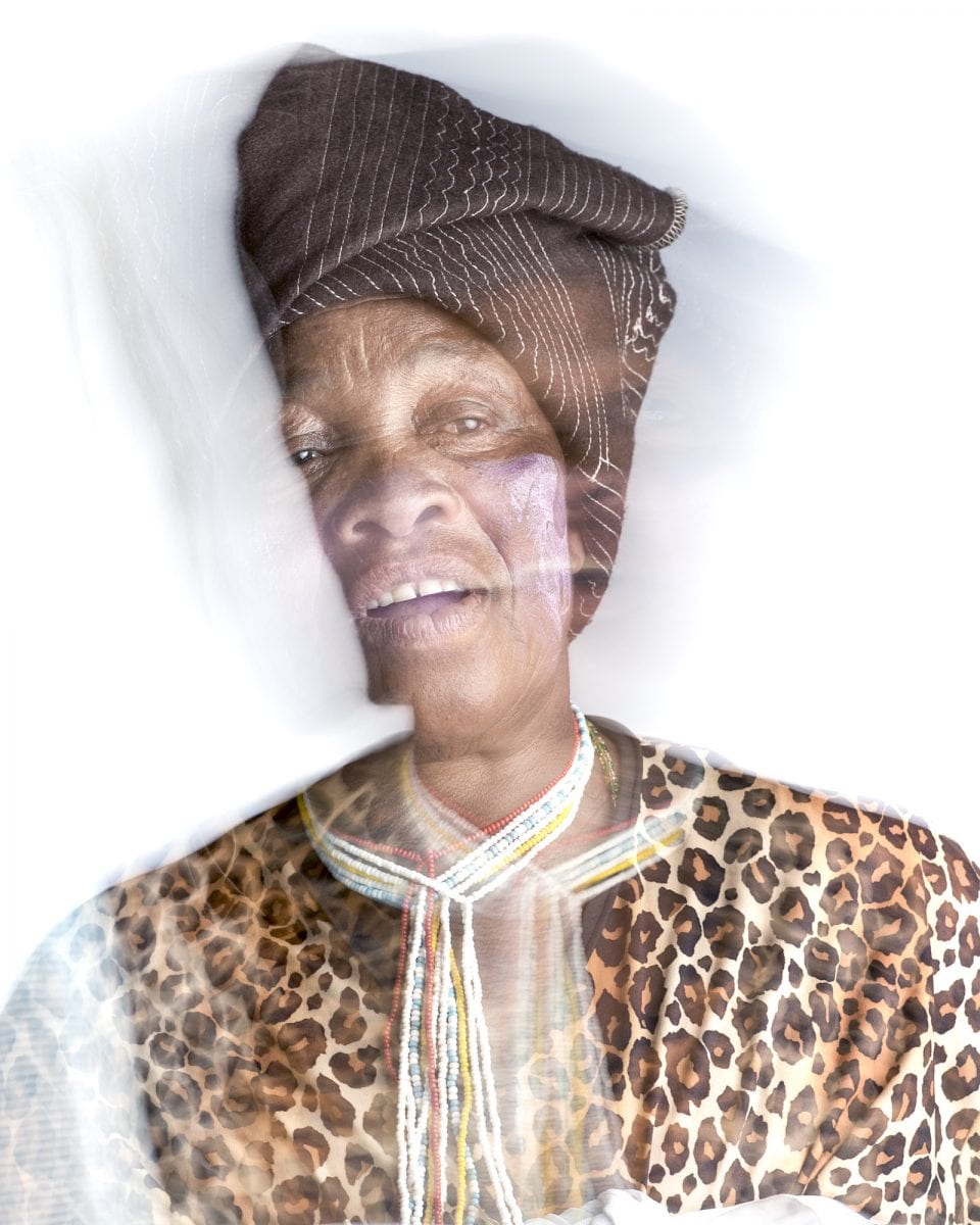 out of focus, blurry, colorful and very contrasted portrait of a healer from South Africa by Thom Pierce