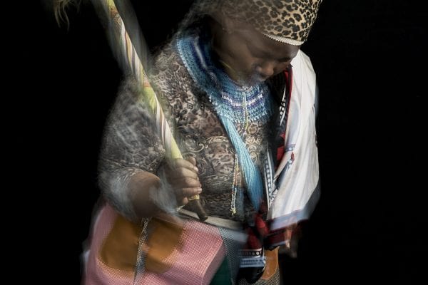 out of focus, blurry, colorful and very contrasted portrait of a healer from South Africa by Thom Pierce