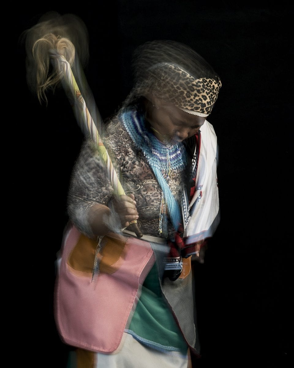 out of focus, blurry, colorful and very contrasted portrait of a healer from South Africa by Thom Pierce