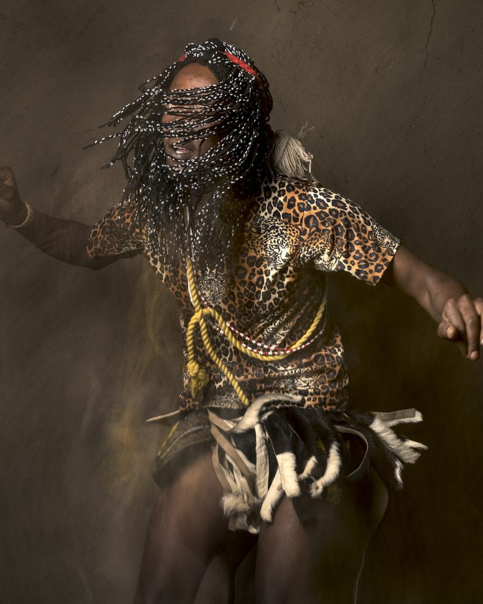 out of focus, blurry, colorful and very contrasted portrait of a healer from South Africa by Thom Pierce