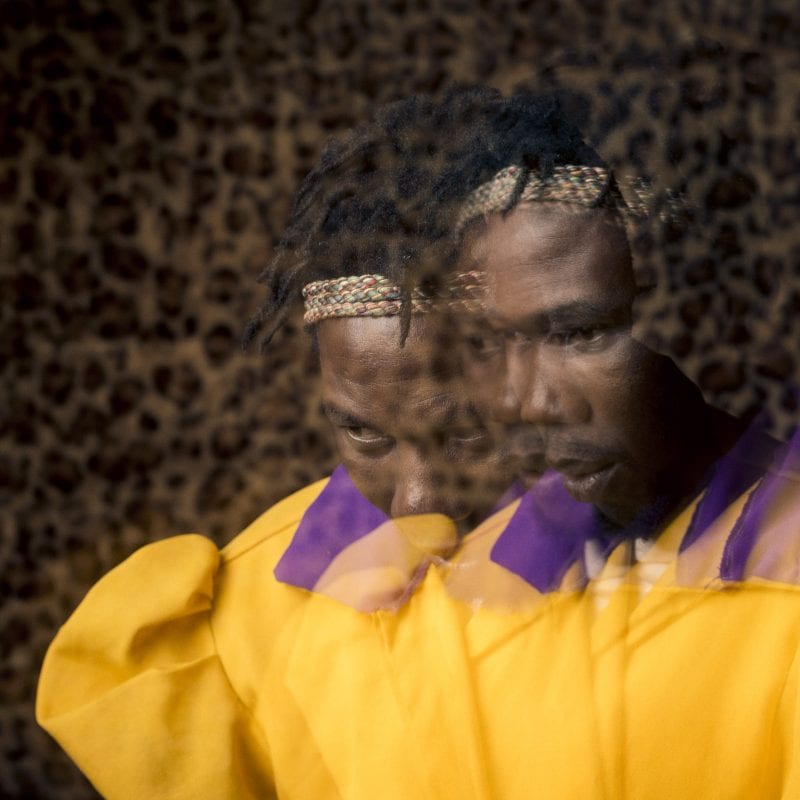 out of focus, blurry, colorful and very contrasted portrait of a healer from South Africa by Thom Pierce