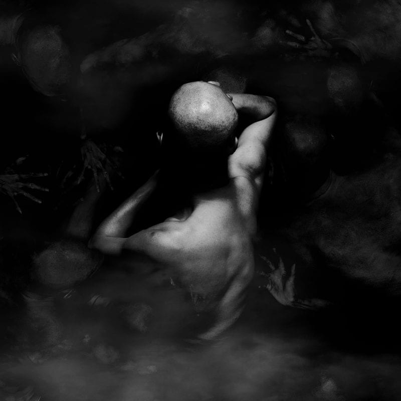 black and white photography of human bodies on a dark background by Korean Photographer Dongwook Lee