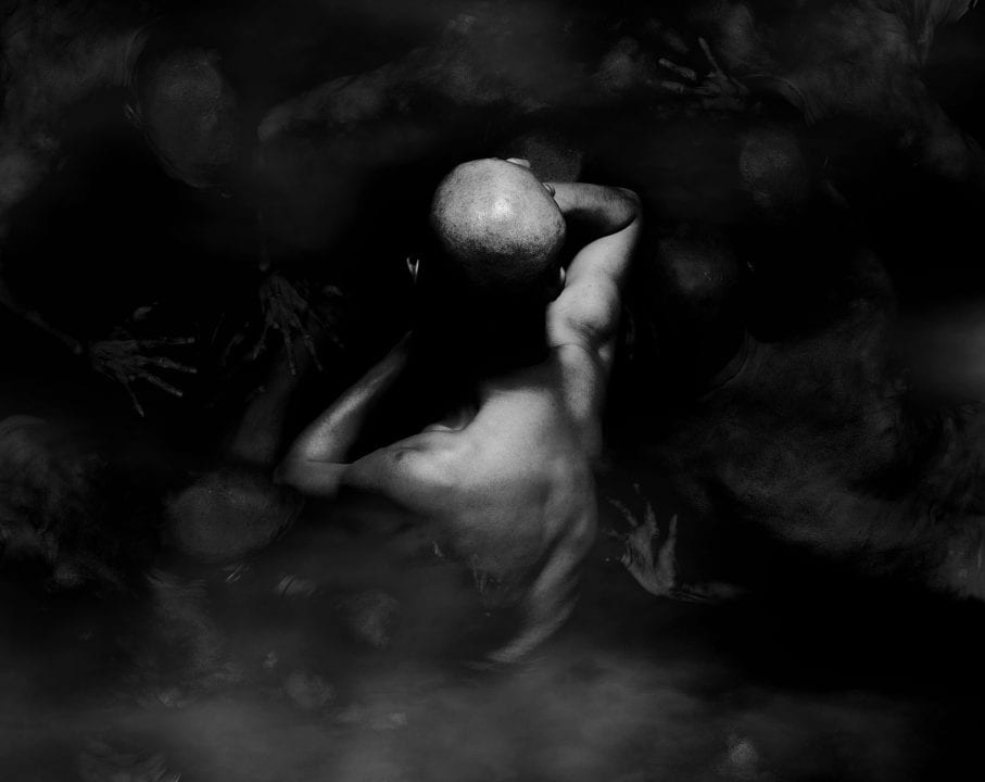 black and white photography of human bodies on a dark background by Korean Photographer Dongwook Lee