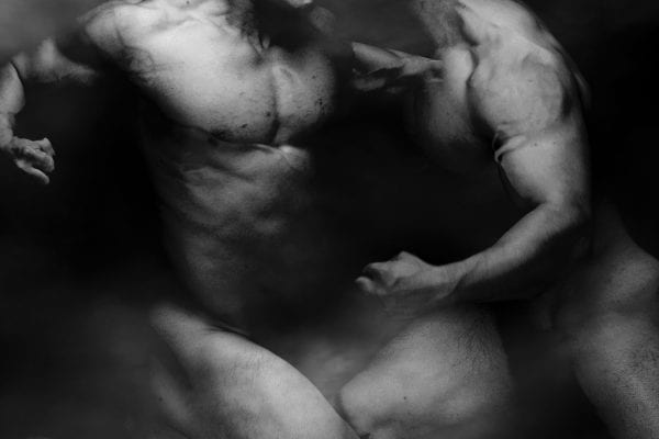 black and white photography of human bodies on a dark background by Korean Photographer Dongwook Lee