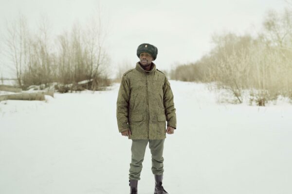 Medium format color portrait of a black man in Russia by Justin Barton