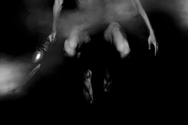 black and white photography of human bodies on a dark background by Korean Photographer Dongwook Lee