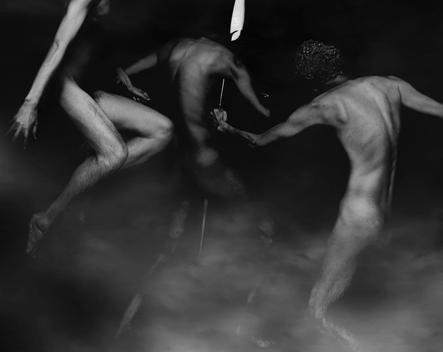 black and white photography of human bodies on a dark background by Korean Photographer Dongwook Lee