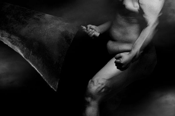 black and white photography of human bodies on a dark background by Korean Photographer Dongwook Lee