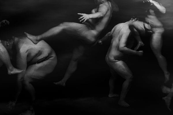 black and white photography of human bodies on a dark background by Korean Photographer Dongwook Lee