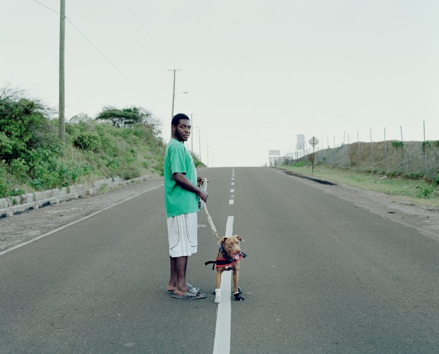 man and his dog color portrait photography in the Caribbean island of Nevis, by Catherine Hyland