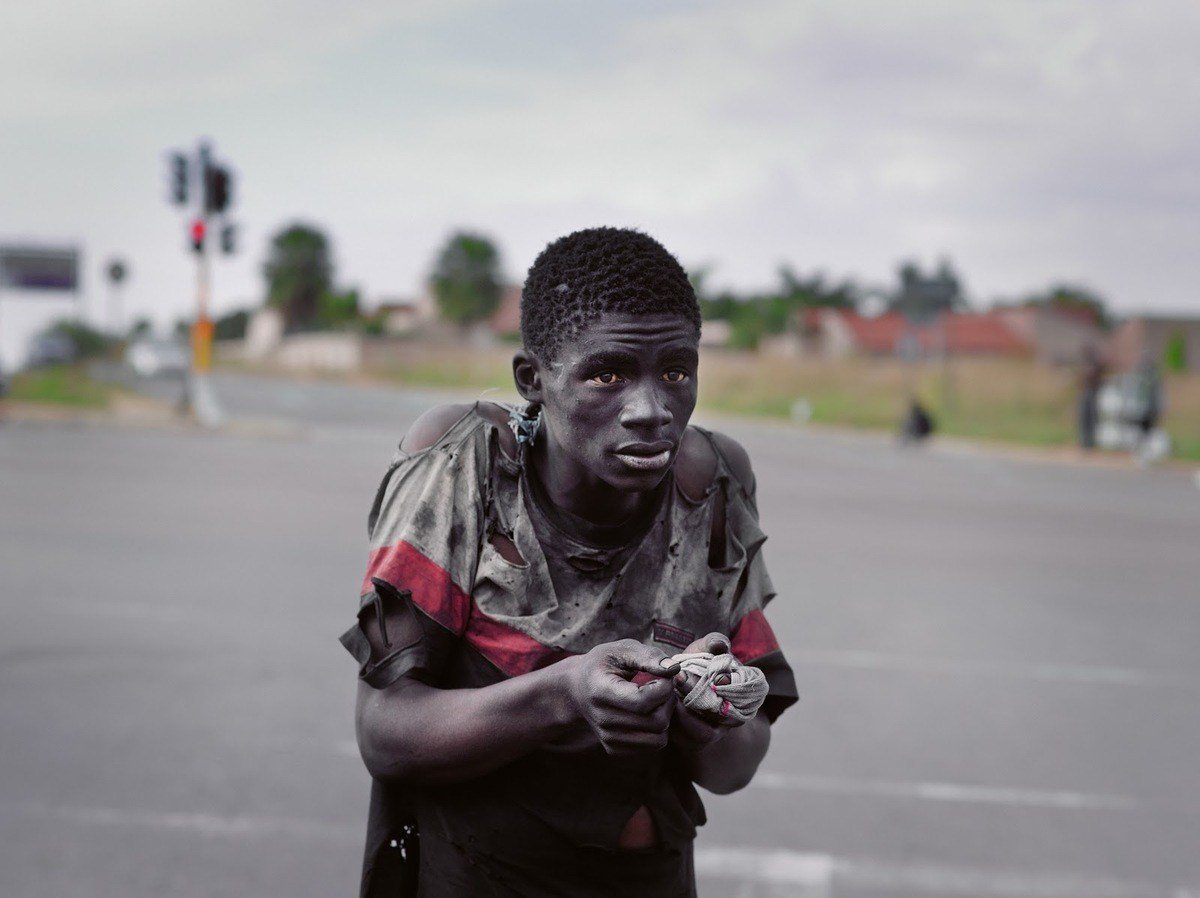 Color Photography At a traffic intersection, Johannesburg, 2011 from Pieter Hugo's Kin