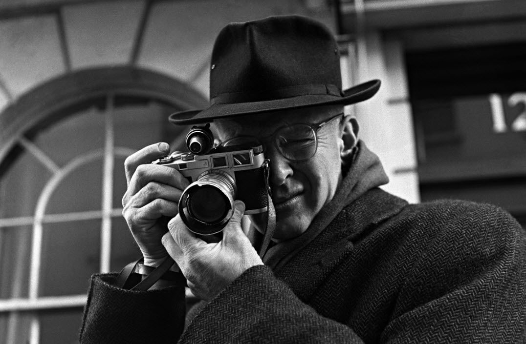 Portrait of Henri Cartier-Bresson with his Leica in 1957 by Jane Bown