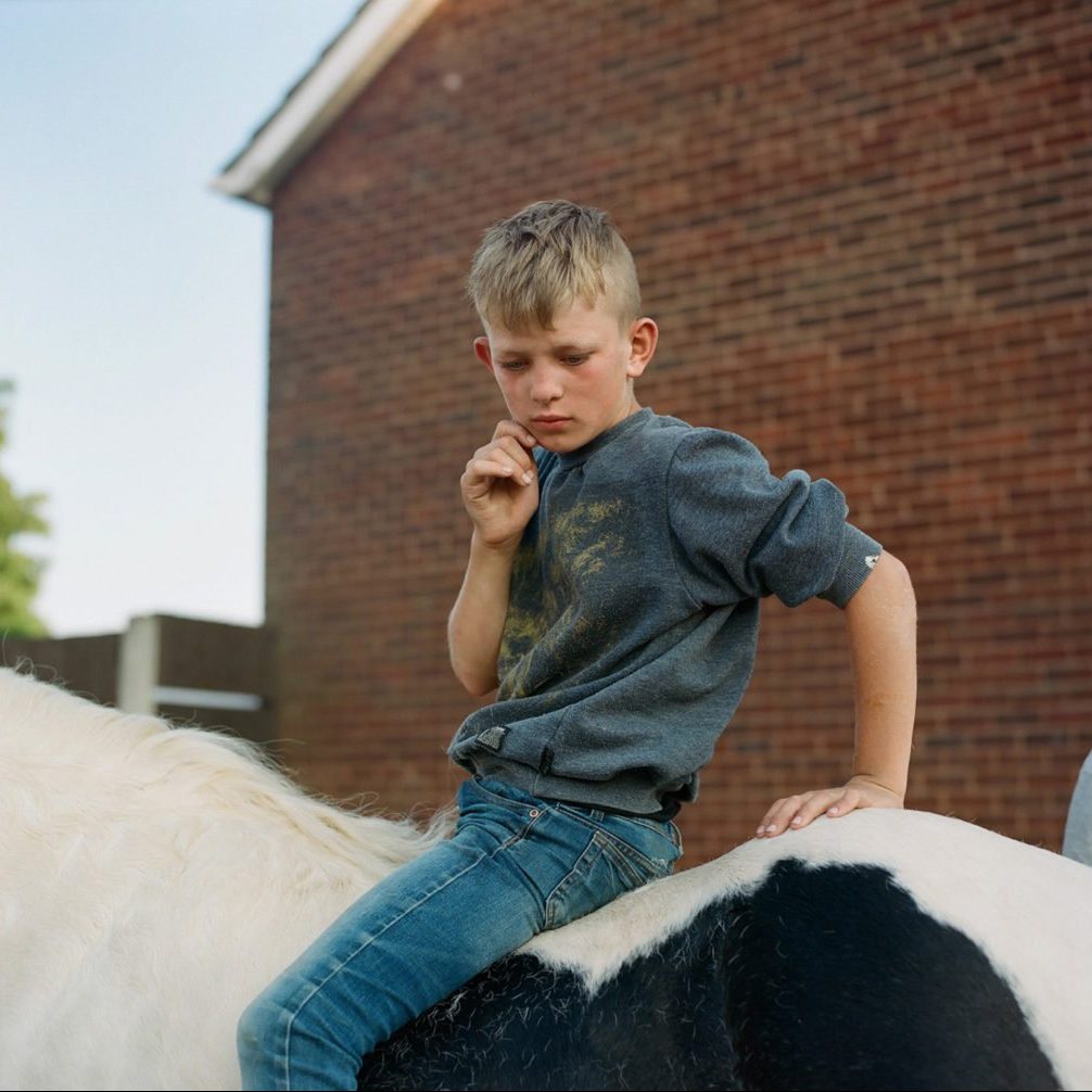 Color film photography by Laura Pannack boy on horse