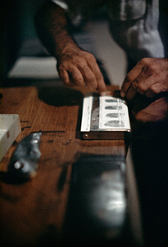 Fingerprinting Addicts for Forging Prescriptions, Chicago, Illinois, 1957 © Courtesy The Gordon Parks Foundation