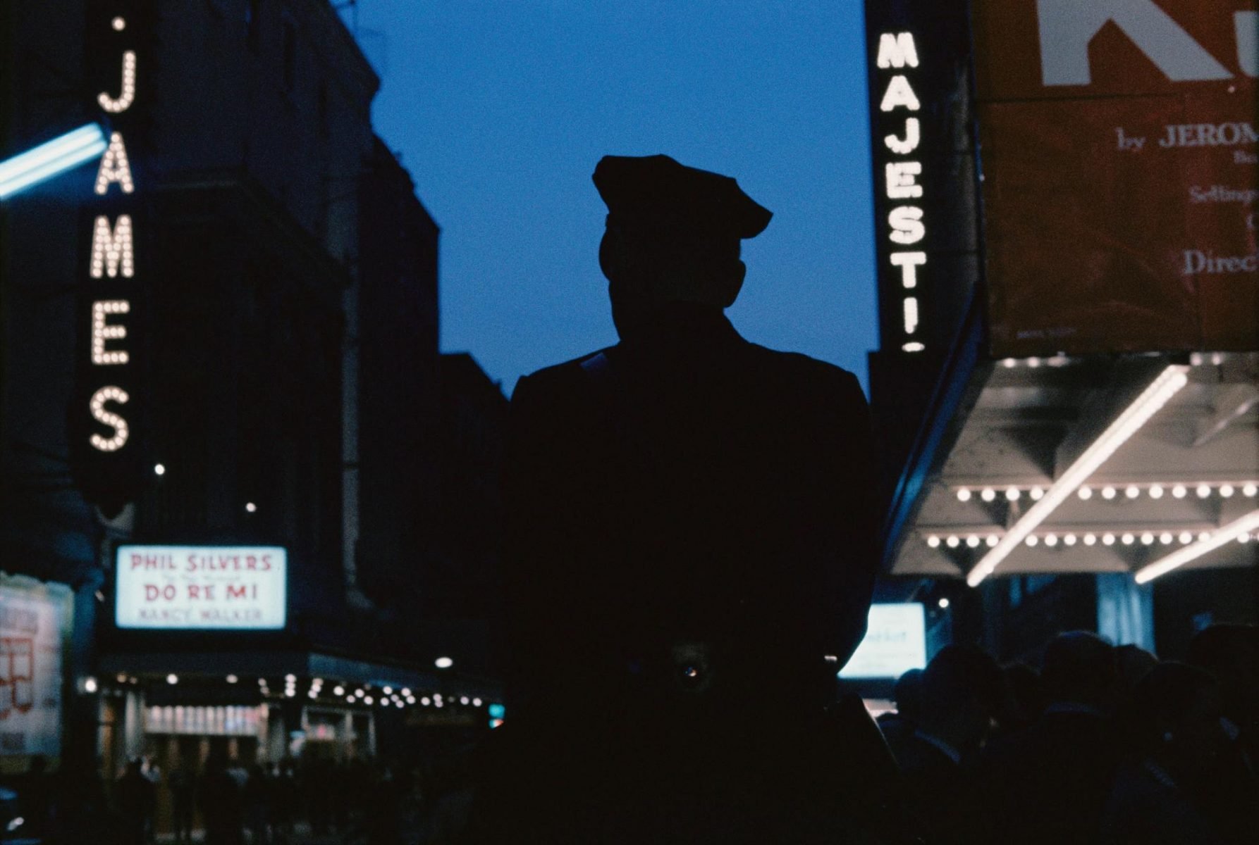 Photograph of a police officer in New york, USA at night. Image by Gordon Parks