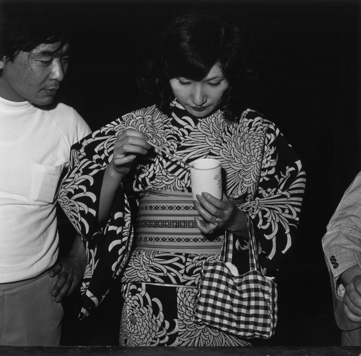 black and white portrait of a woman and a man by Issei Suda