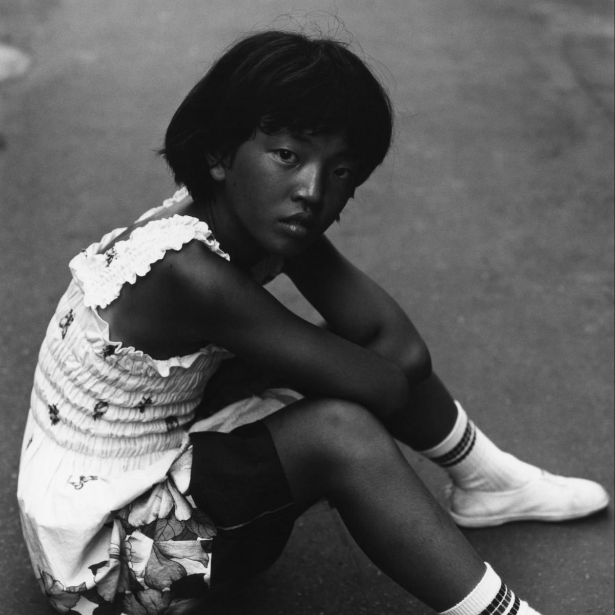 Black and white portrait of a young girl in japan by Issei Suda