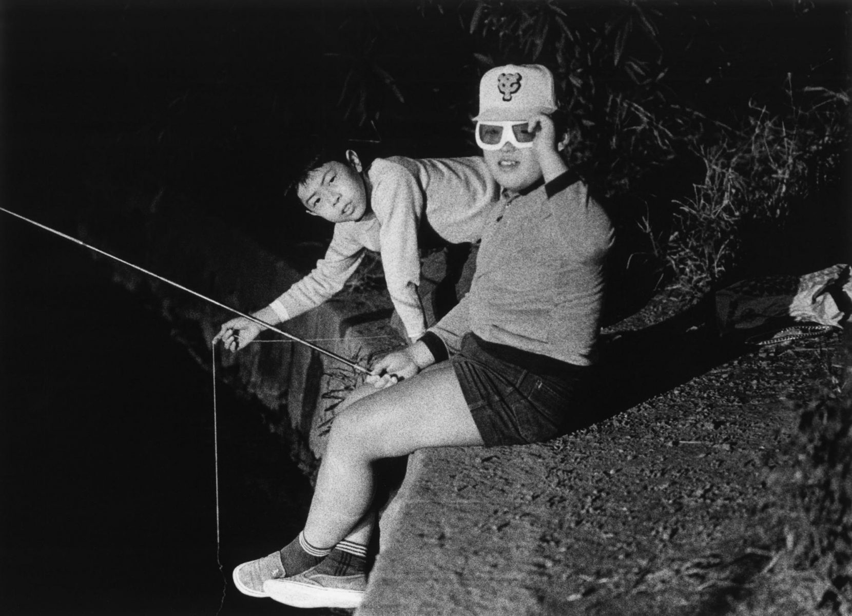 Black and white portrait of two boys in japan by Issei Suda