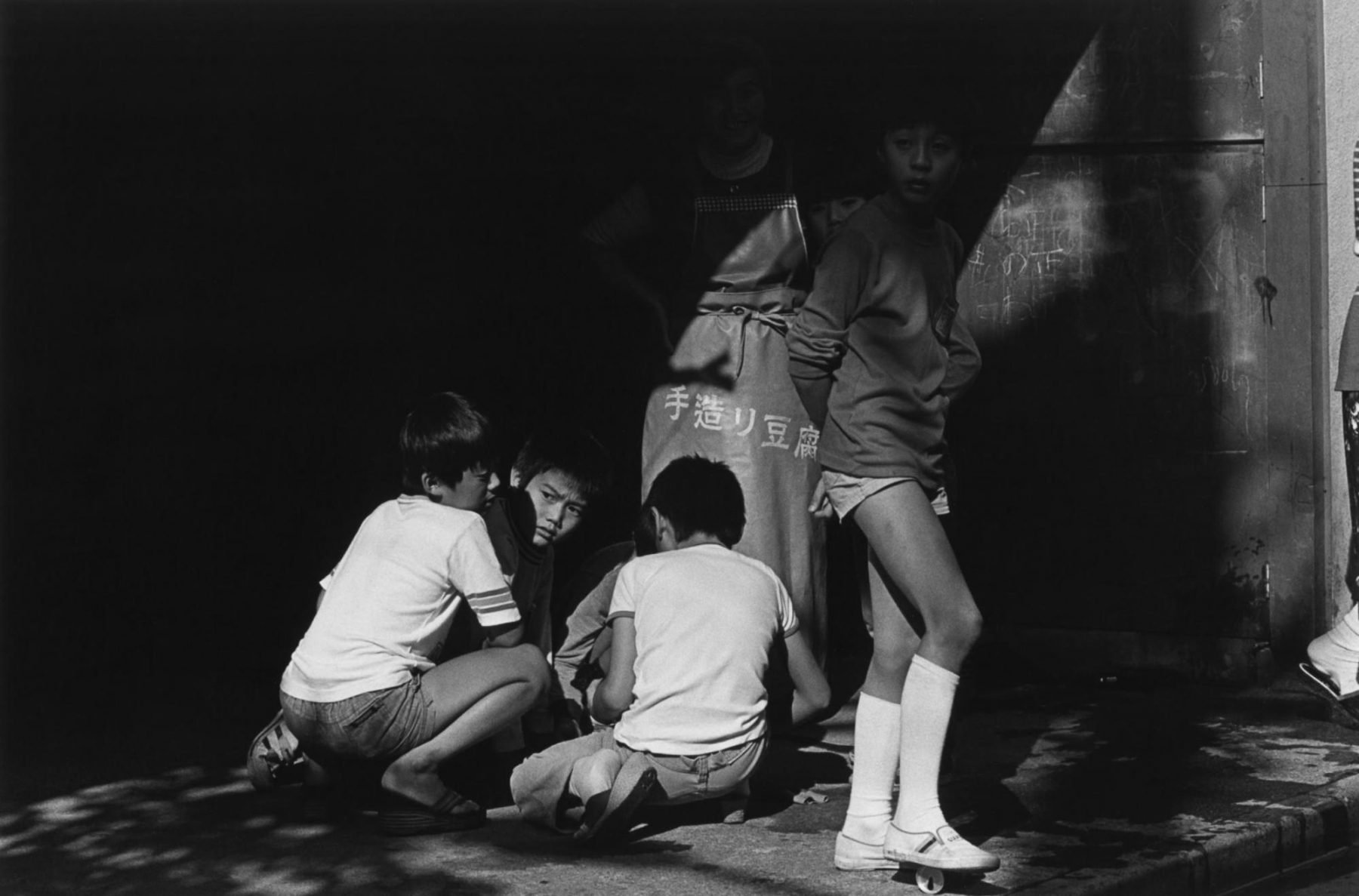 Black and white portrait of three boys in Tokyo, japan by Issei Suda