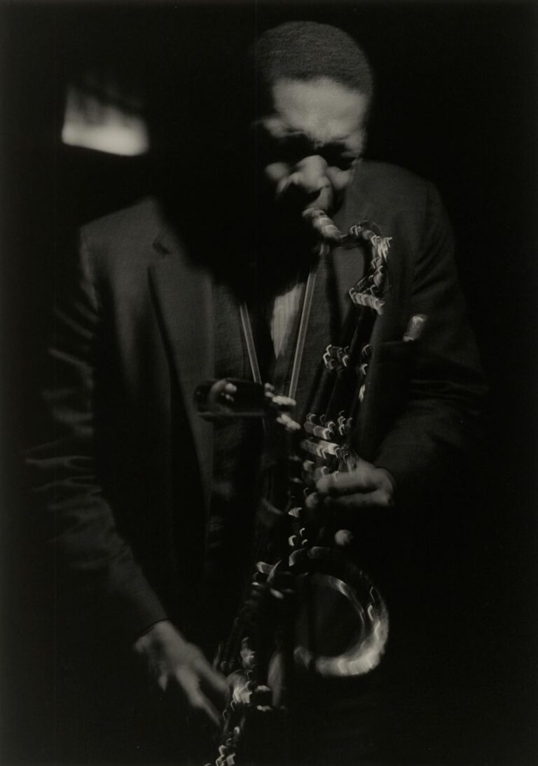 Picture of John Coltrane playing the saxaphone in 1961 by Roy De Carava