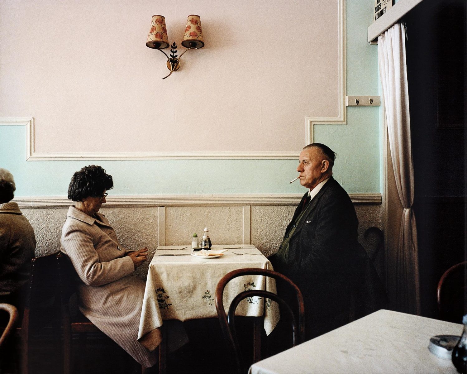 Color photo by Martin Parr elderly couple dining, New Brighton, England, 1980s