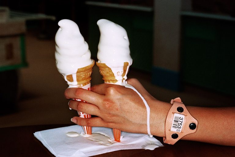 Color photo by Martin Parr melting ice creams, hand, Japan, Tokyo