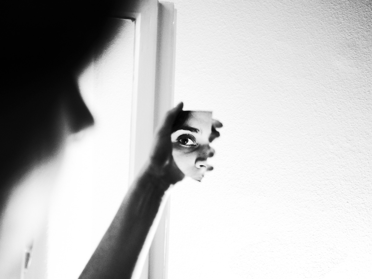 black and white image of a face reflexion in mirror by Kseniia Apresian