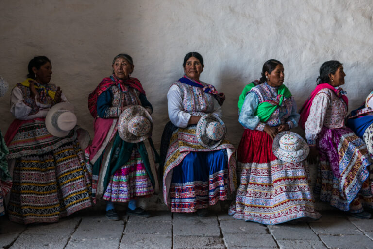 Color photo by Luis Fabini from the series Harvest. Group portrait, indigenous woman, Andes Mountains, Peru