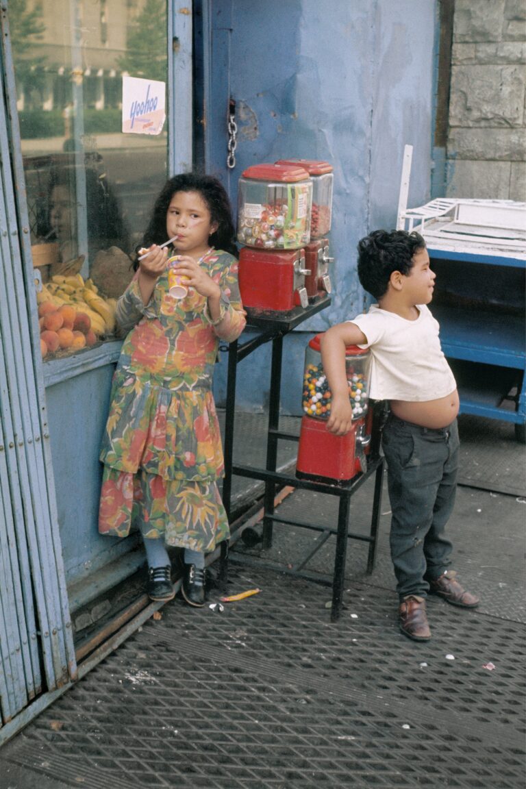 Color street photography by Helen Levitt, children eating candy, NYC