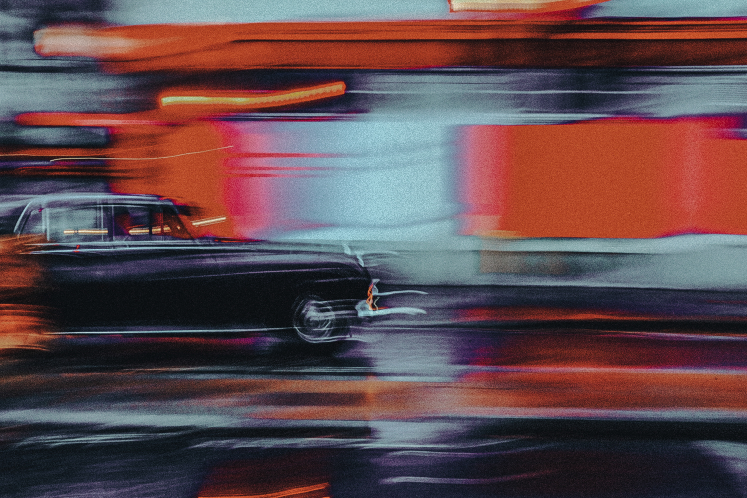 Color street photography by Francesco Gioia. Car driving, blur