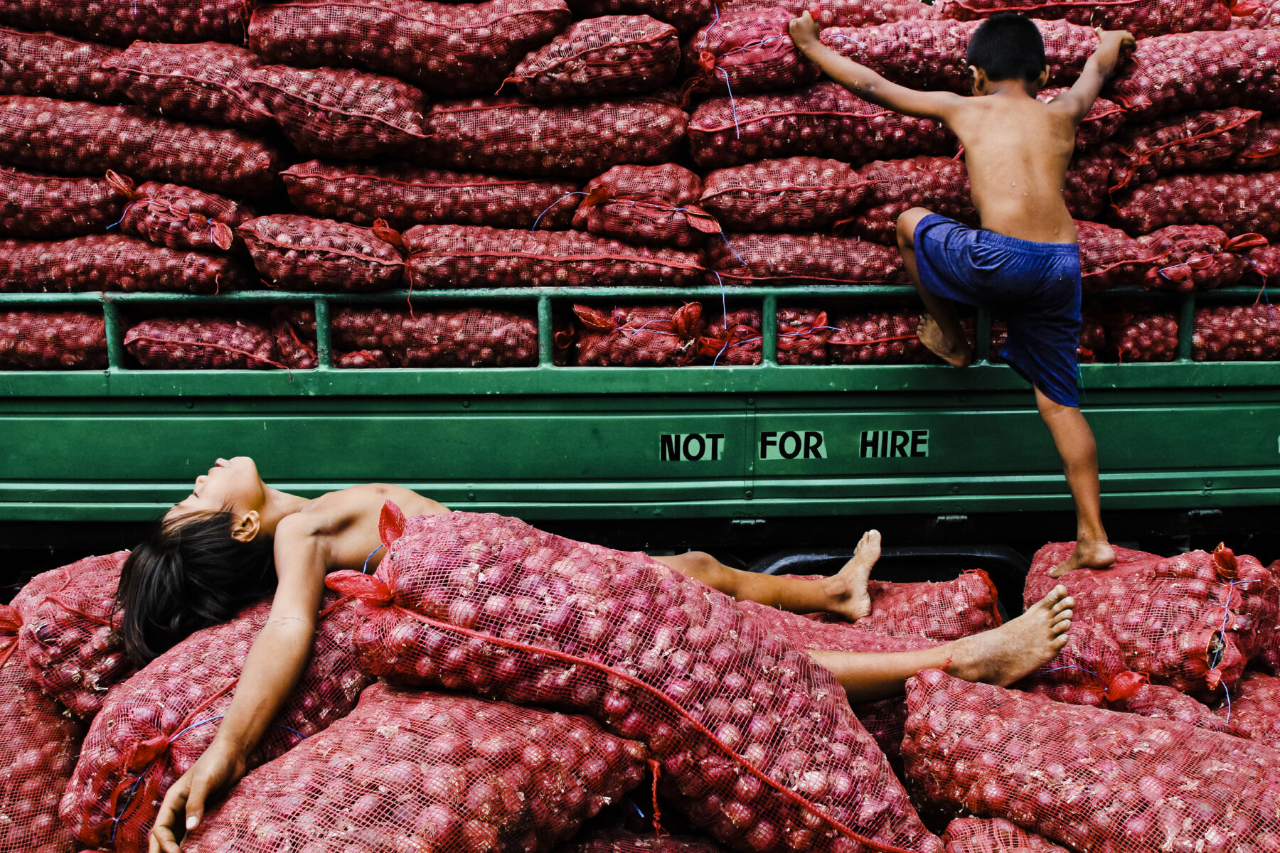 color street photo of kids in Dumaguete City, Philippines by Hersley-Ven Casero