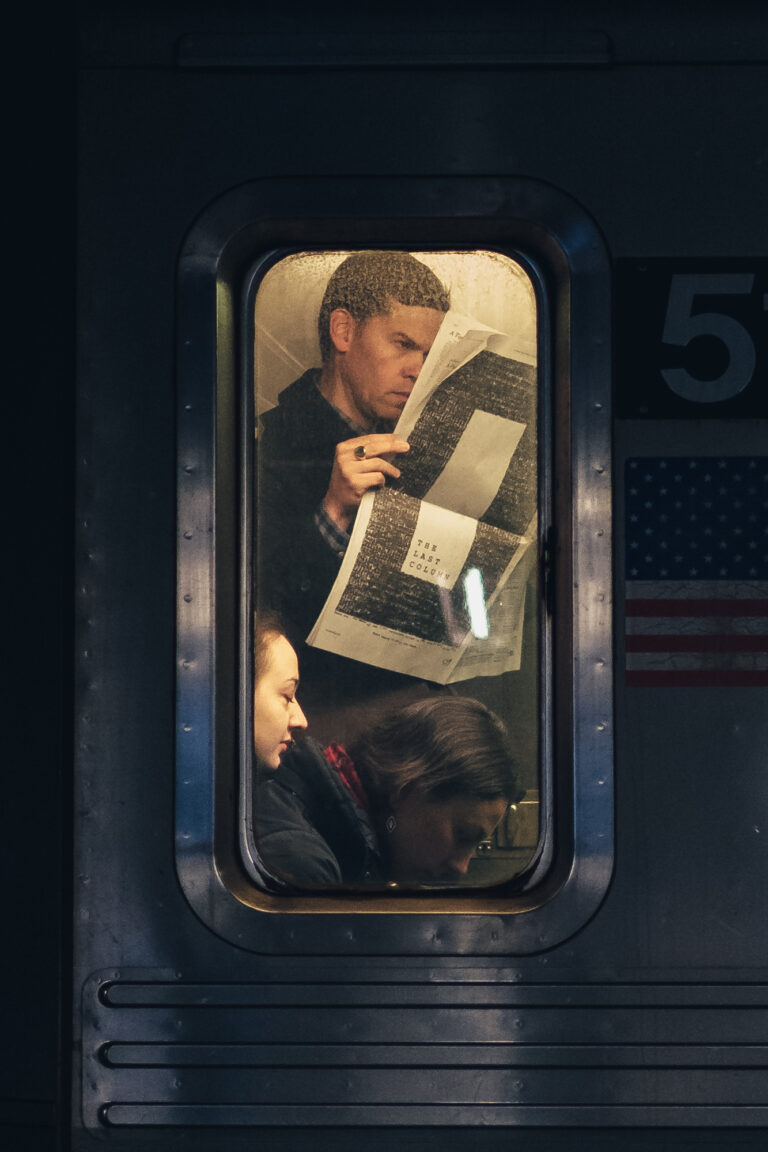 color photo of Daily commuters riding the New York subway by Manuel Pena