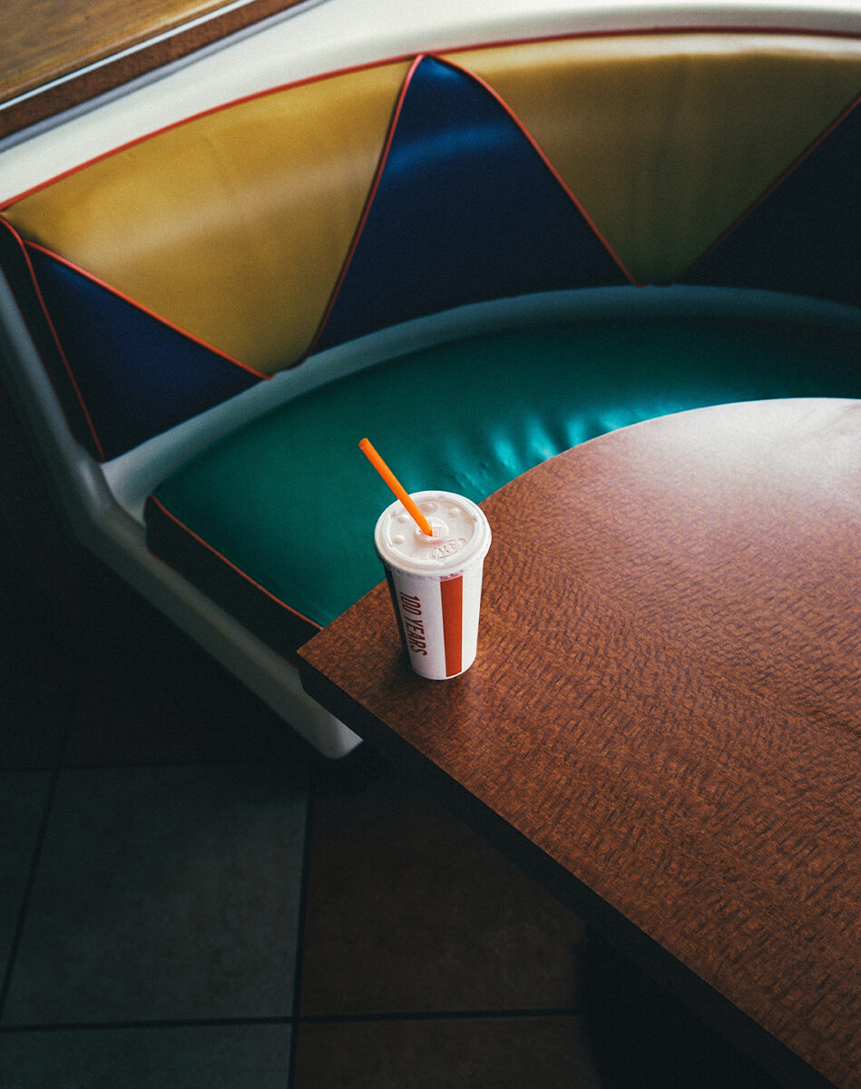 Color photo by Arnaud Montagard, soda on diner table. From the Road Not Taken