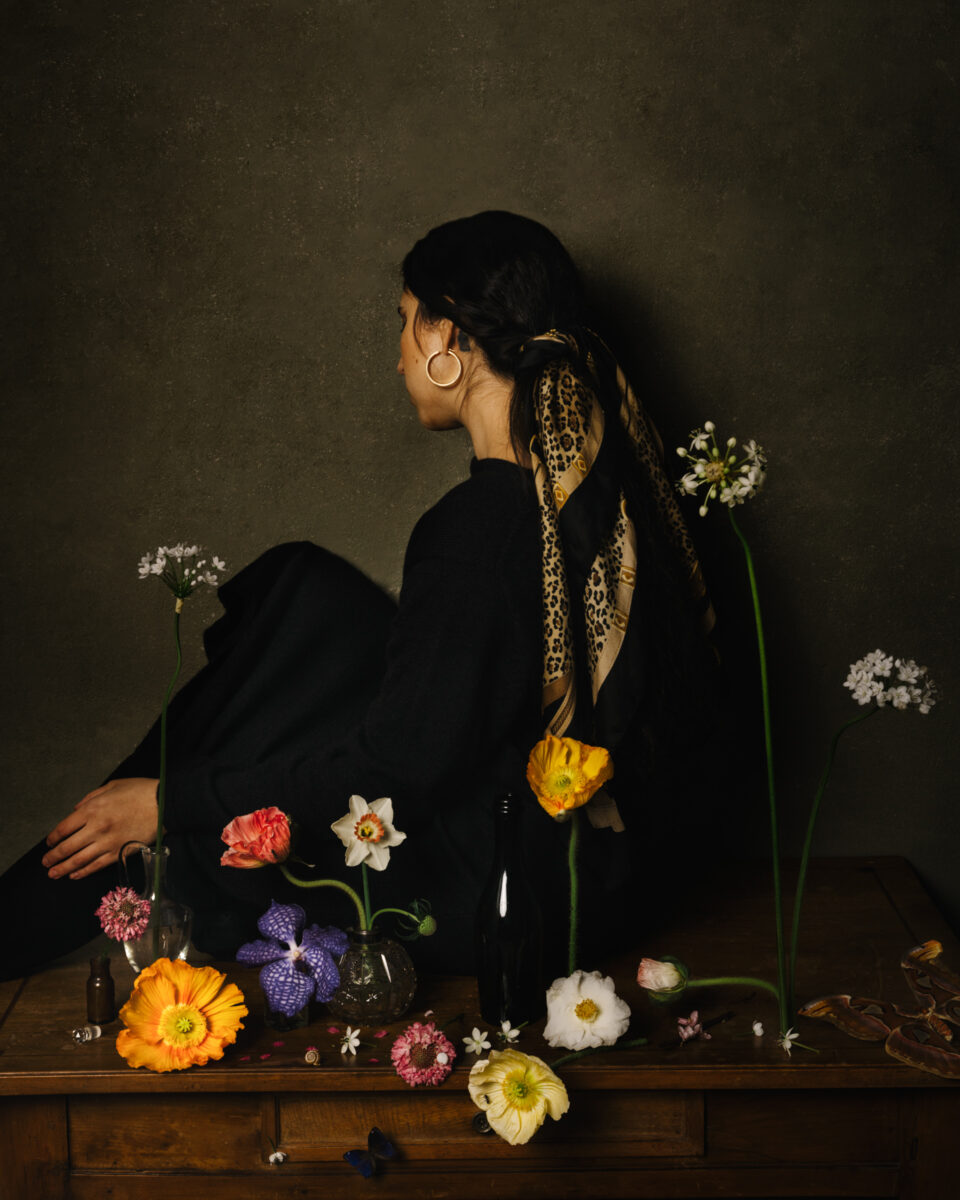 color studio portrait of a woman and flowers by Daniela Constantini